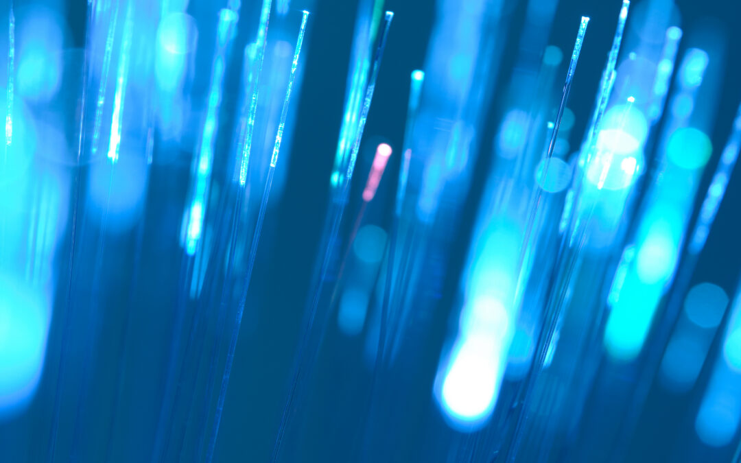Upward flowing fiber optic light streams in blue representing the forward momentum and operational clarity Avantra delivers throughout SAP S/4HANA migration and hypercare
